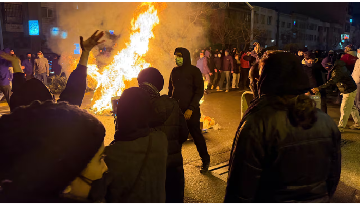 “Protesters gather across Iranian cities demanding economic relief and political change.”